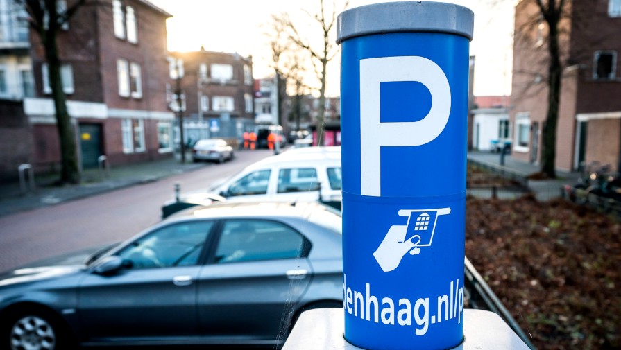 Parking sign and parked cars